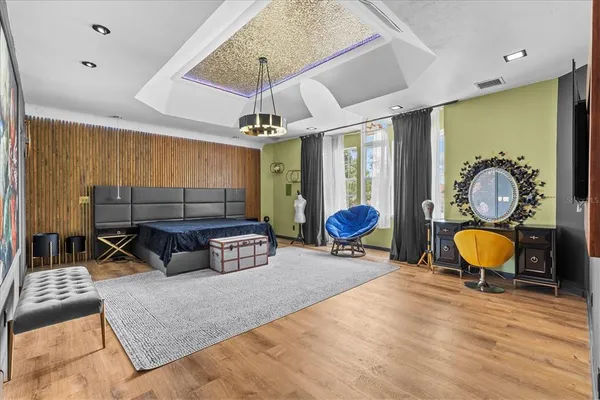 a spacious bedroom with a bed and a table