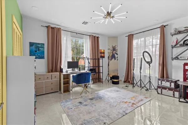 an aerial view of a house with a yard and lake view