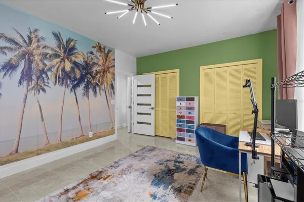 an aerial view of a house with a yard and lake view