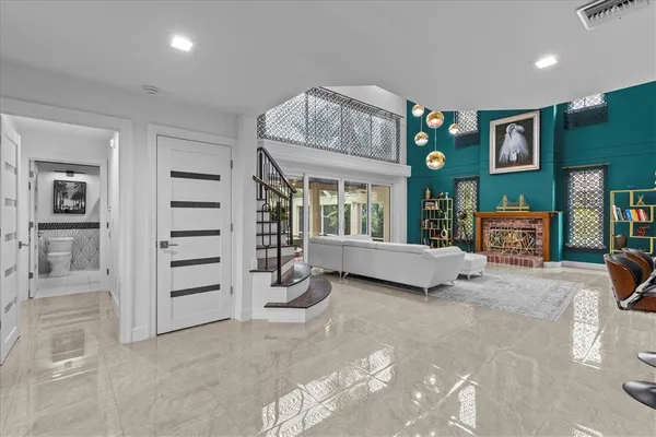 a living room with furniture and a flat screen tv