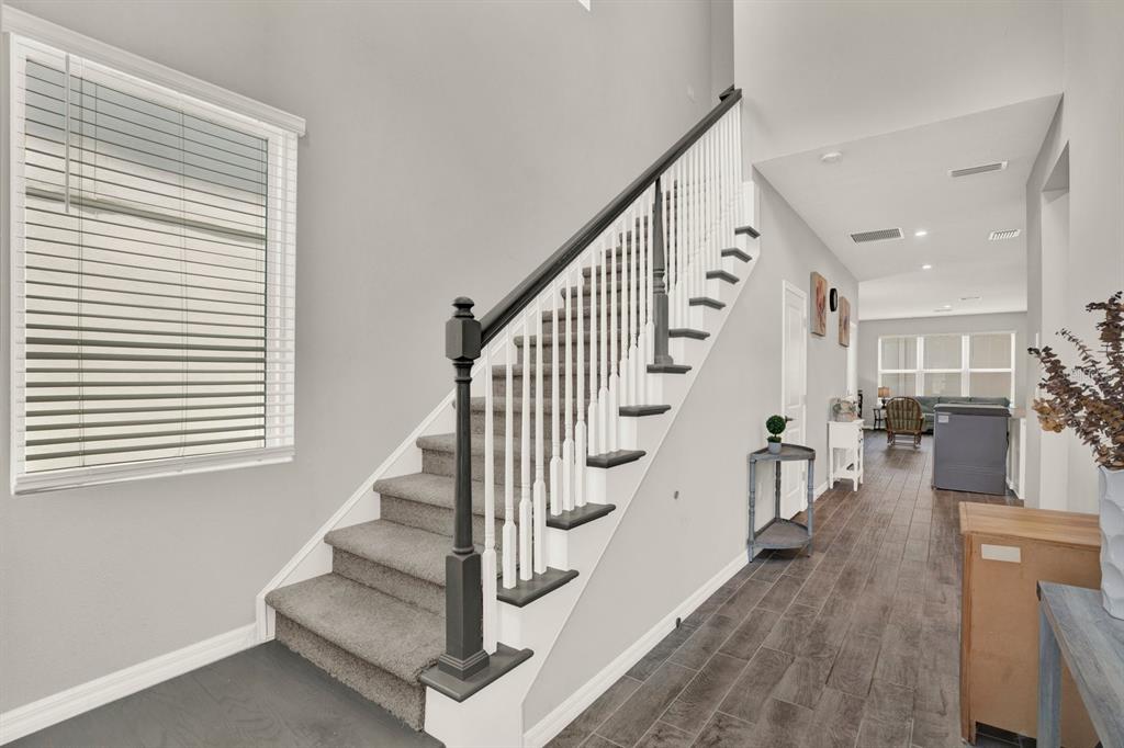 13729 Rangeland Boulevard Odessa, FL 33556 - Photo 12 of 30 a view of entryway and hall with wooden floor