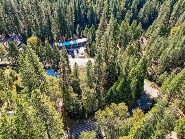 a view of a house with a tree