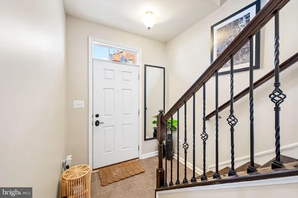 a view of an entryway with wooden floor and door