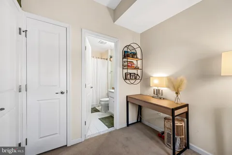 a view of room with window and furniture