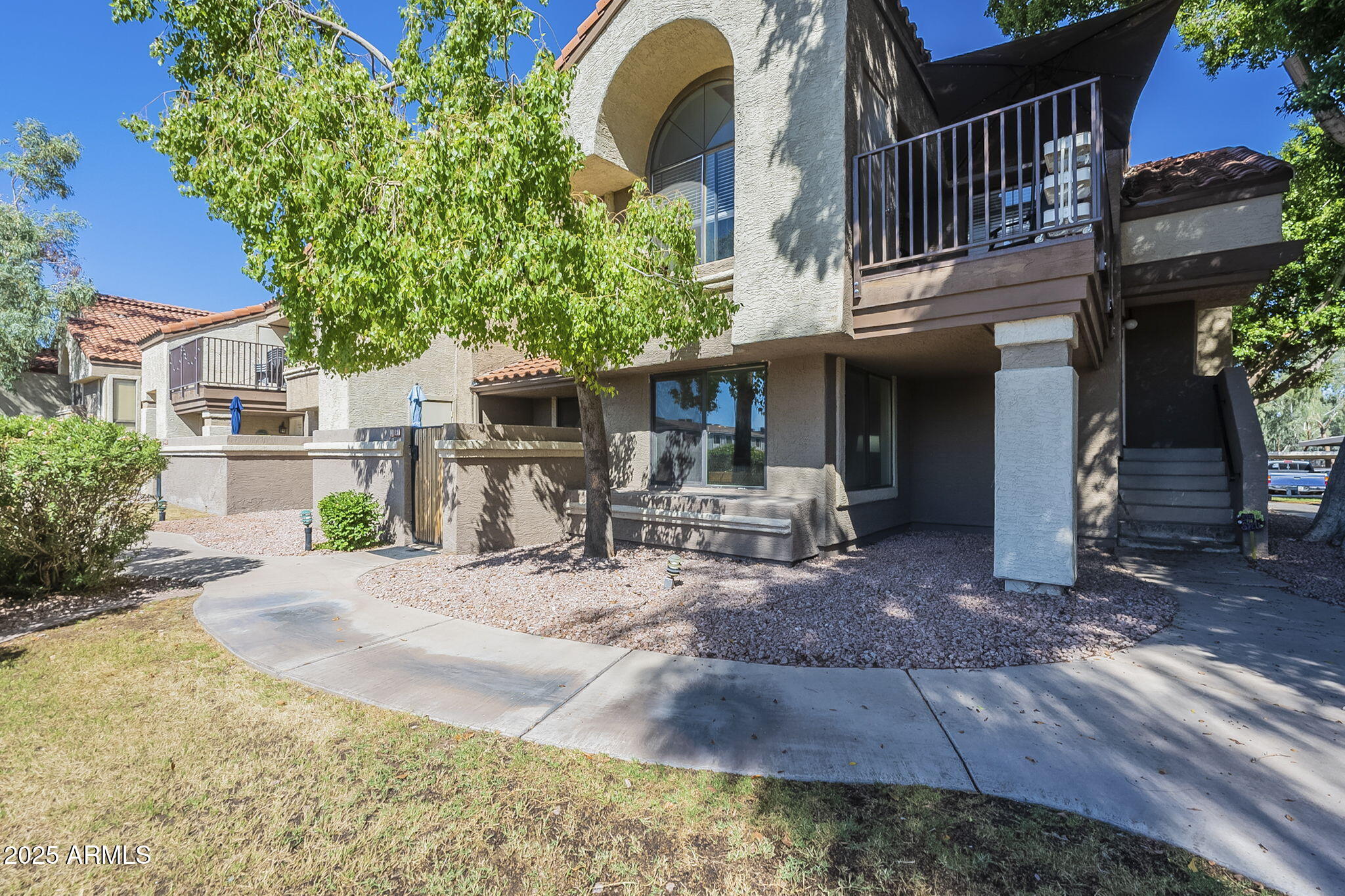 1905 East University Drive, Unit 131 Tempe, AZ 85288 - Photo 1 of 36 a view of a house with backyard and sitting area