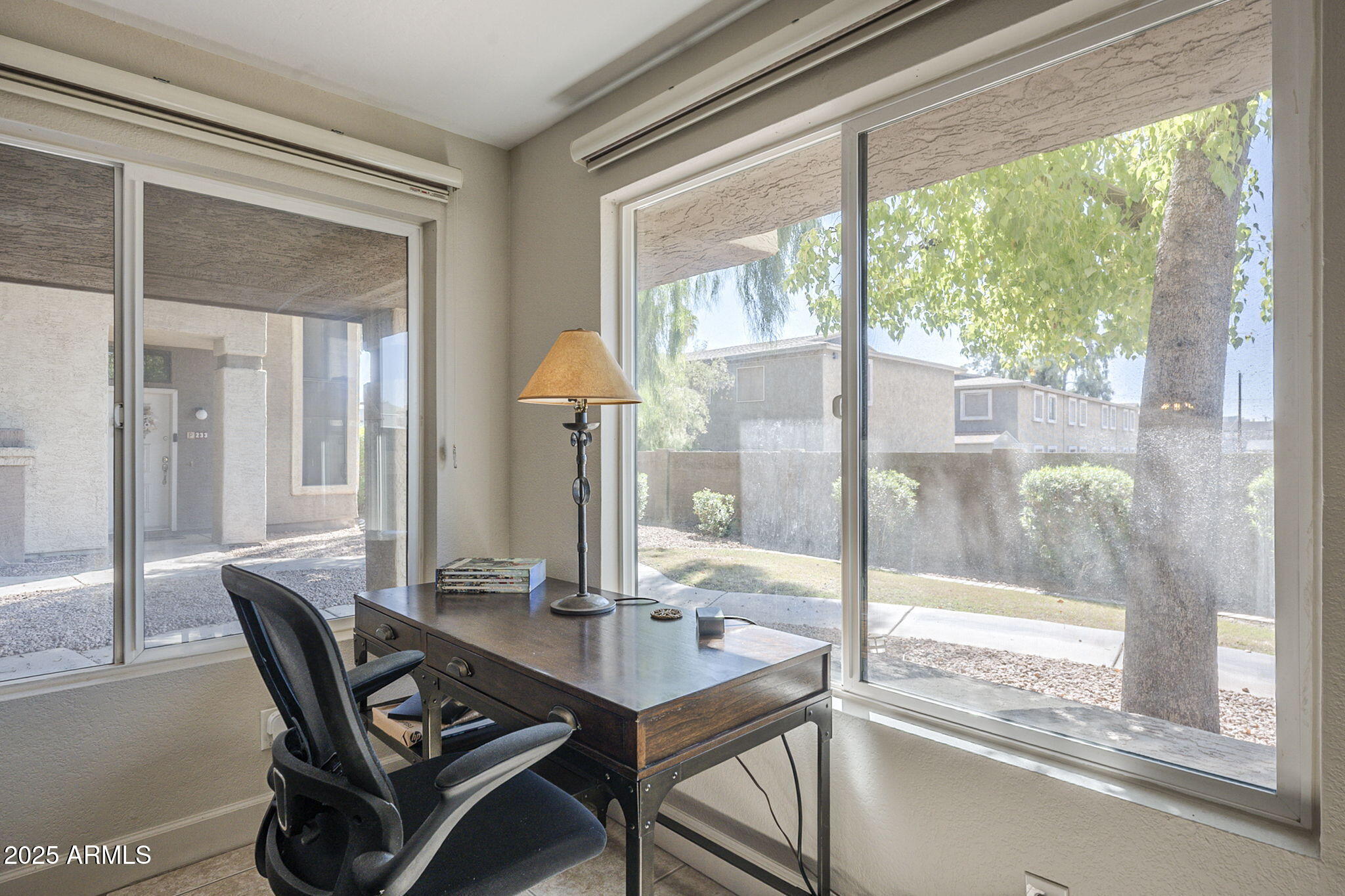 1905 East University Drive, Unit 131 Tempe, AZ 85288 - Photo 11 of 36 a dining room with a glass top table and chairs