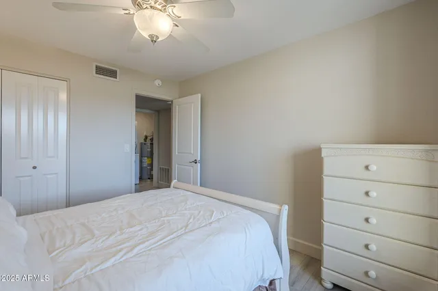 a bedroom with a bed and a dresser