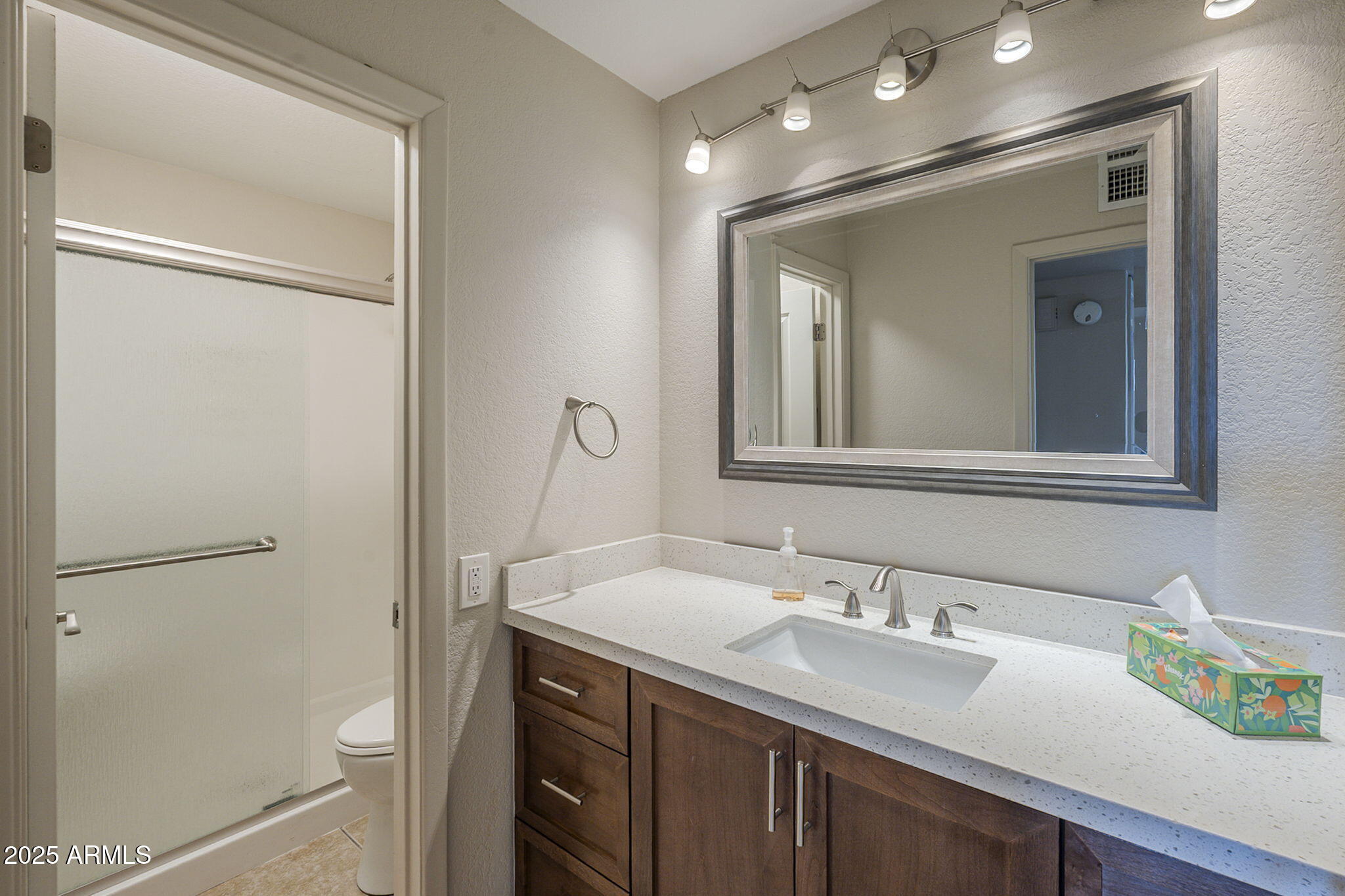 1905 East University Drive, Unit 131 Tempe, AZ 85288 - Photo 24 of 36 a bathroom with a sink and a mirror
