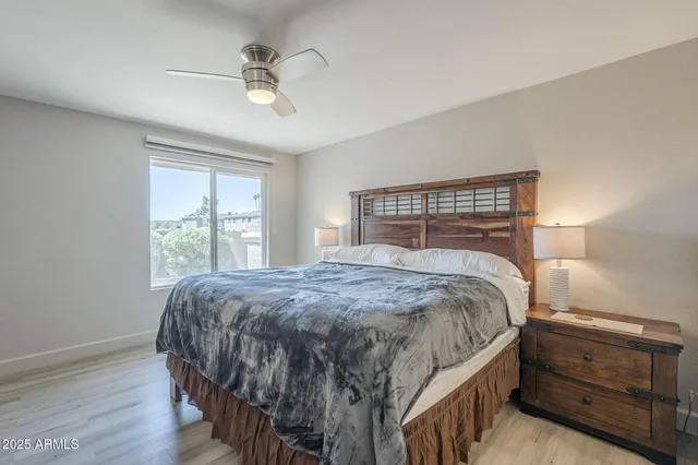 a bedroom with a bed and a dresser