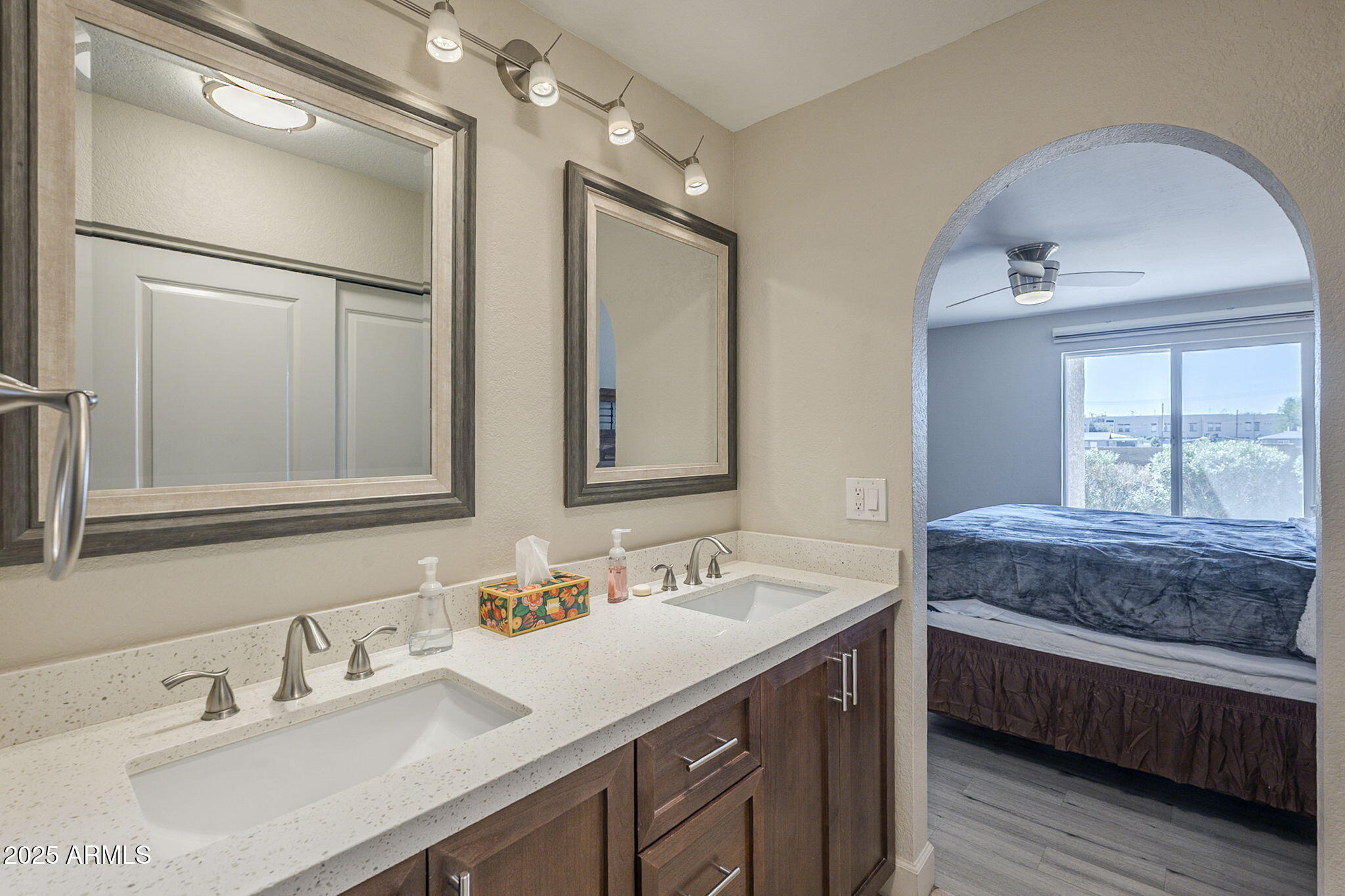1905 East University Drive, Unit 131 Tempe, AZ 85288 - Photo 31 of 36 a en suite bathroom with a double vanity sink and a mirror