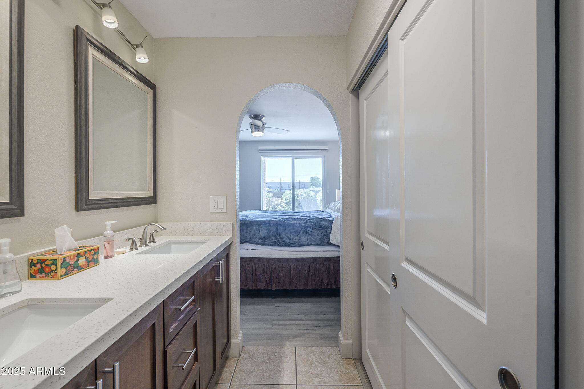 1905 East University Drive, Unit 131 Tempe, AZ 85288 - Photo 32 of 36 a en suite bathroom with a sink and a mirror