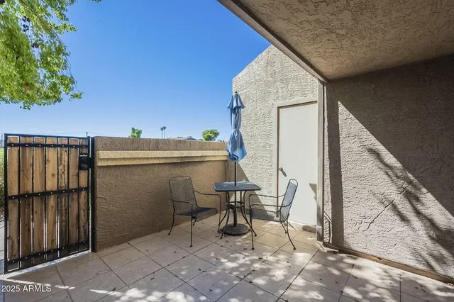 a view of balcony with furniture