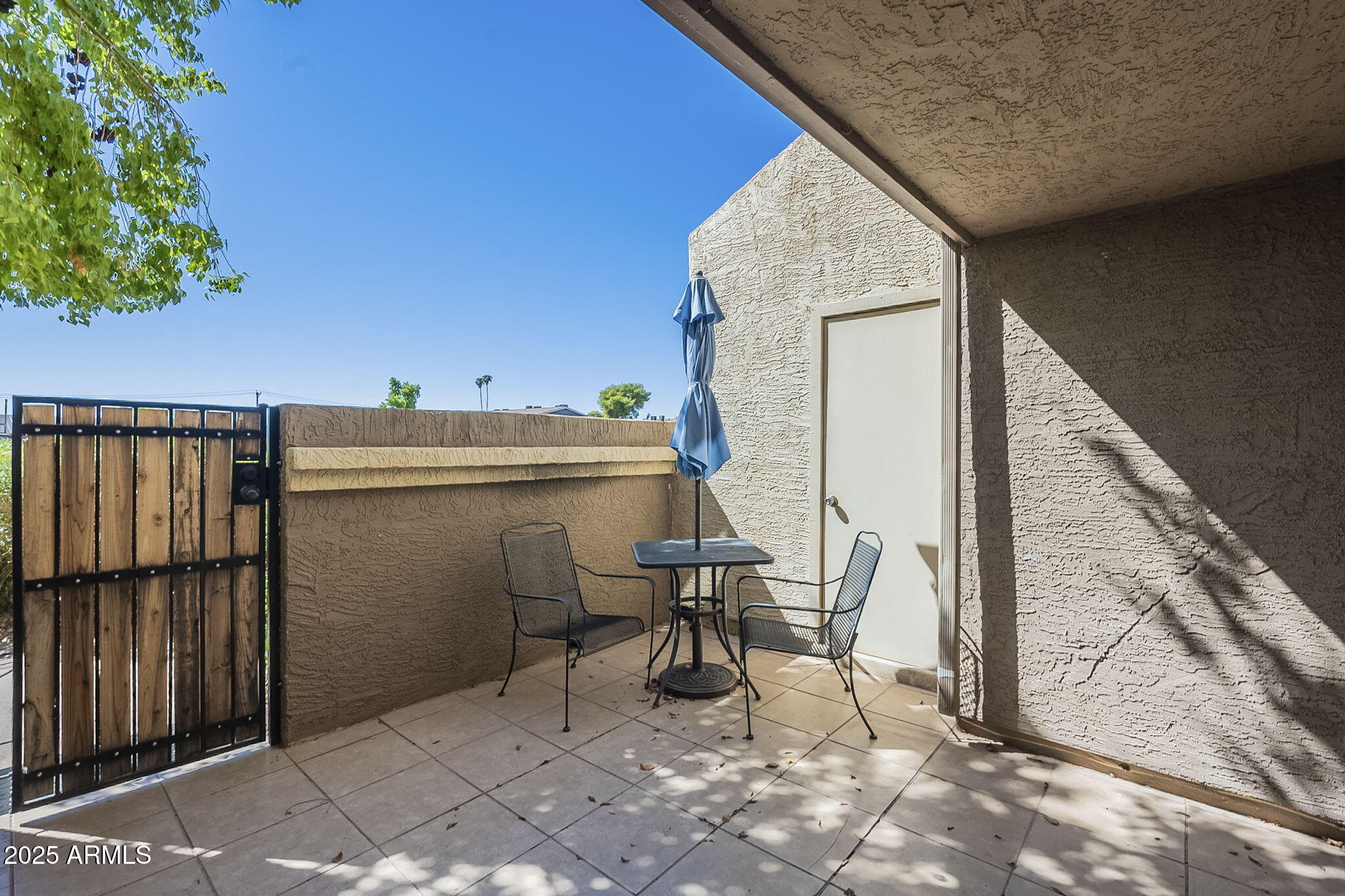 1905 East University Drive, Unit 131 Tempe, AZ 85288 - Photo 4 of 36 a view of balcony with furniture