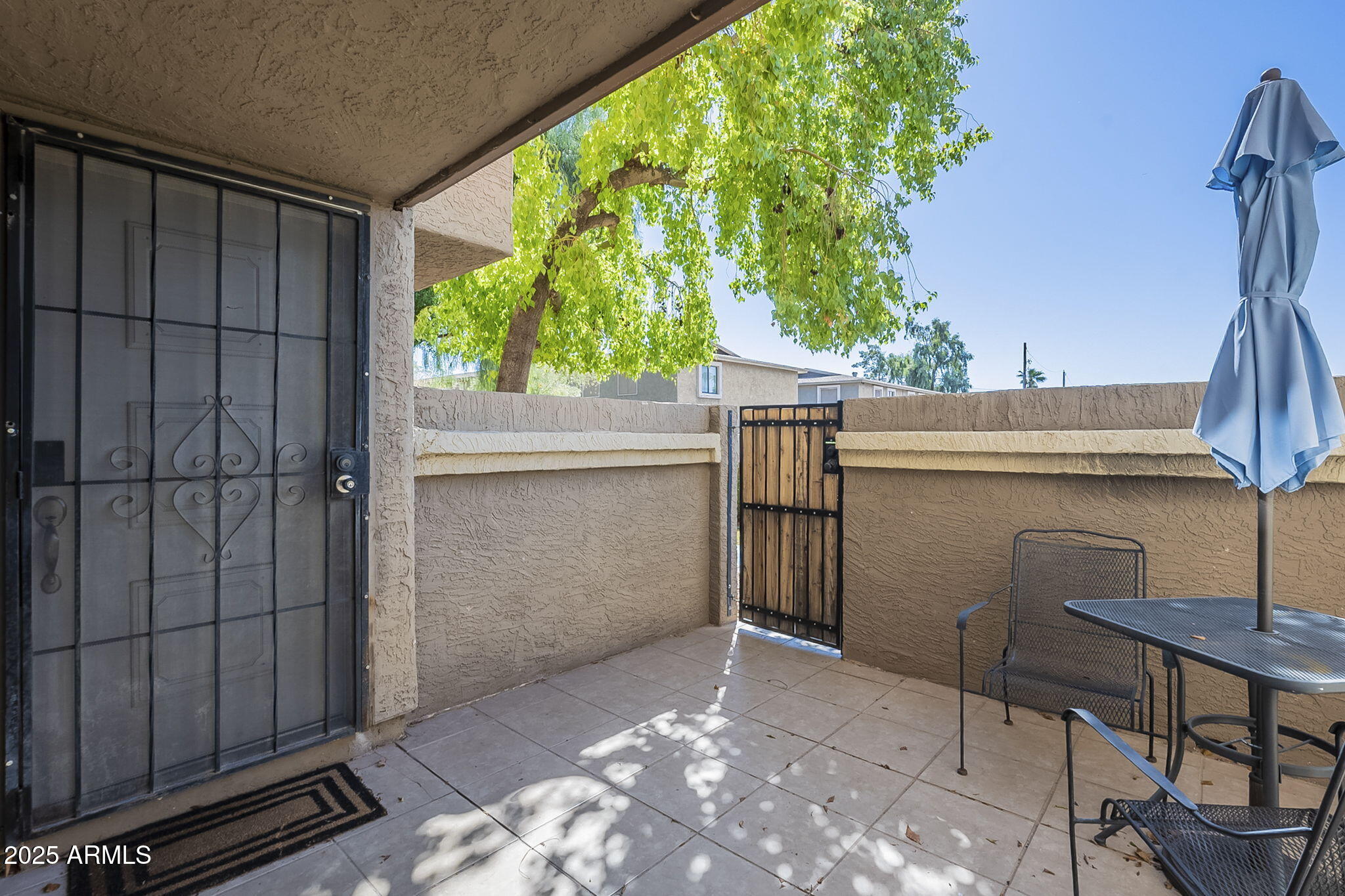 1905 East University Drive, Unit 131 Tempe, AZ 85288 - Photo 5 of 36 a view of a porch with furniture and a yard