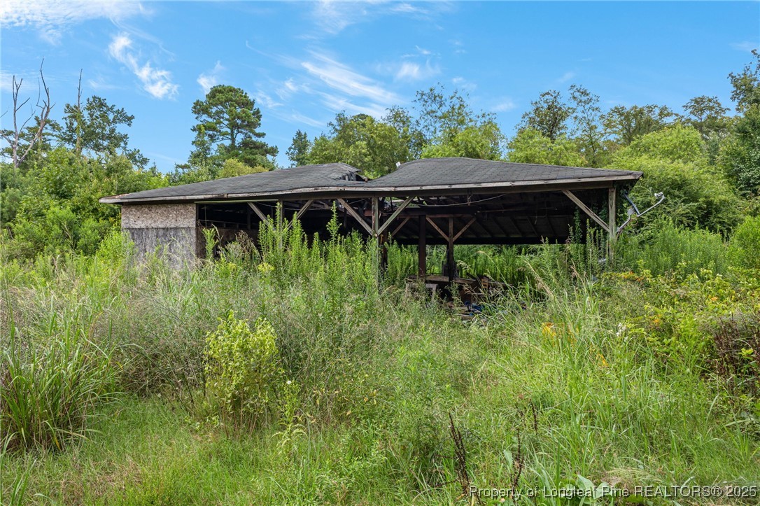 3402 Pine Log Road Lumberton, NC 28360 - Photo 11 of 24 a view of outdoor space kitchen and patio