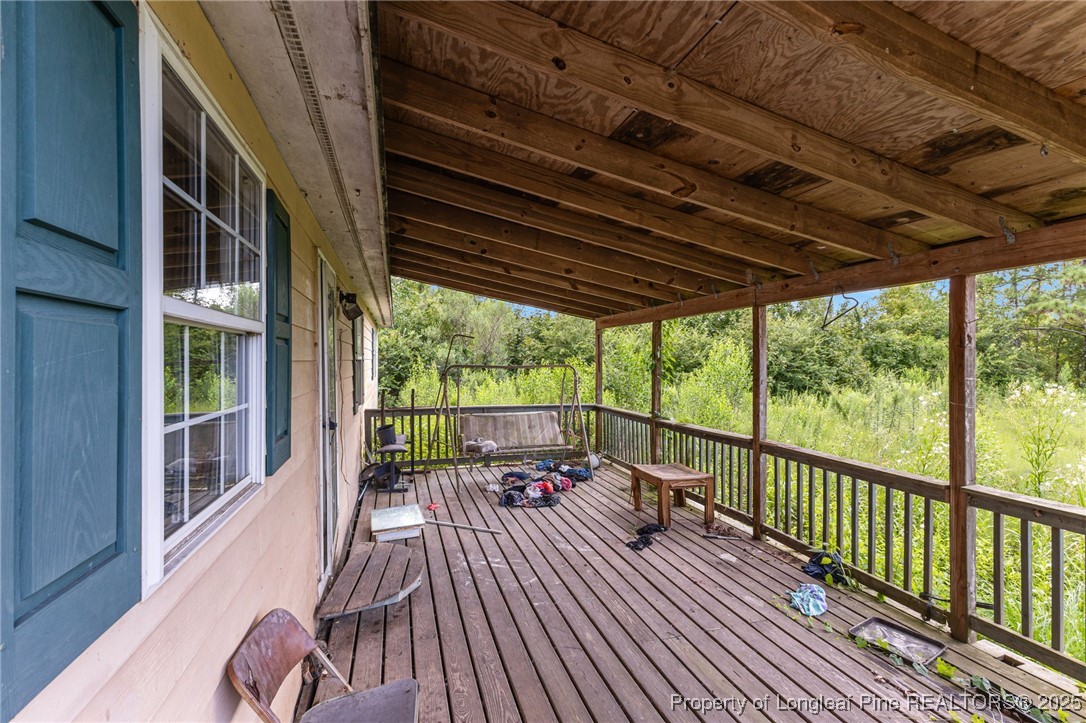 3402 Pine Log Road Lumberton, NC 28360 - Photo 4 of 24 a view of balcony with couch and wooden floor