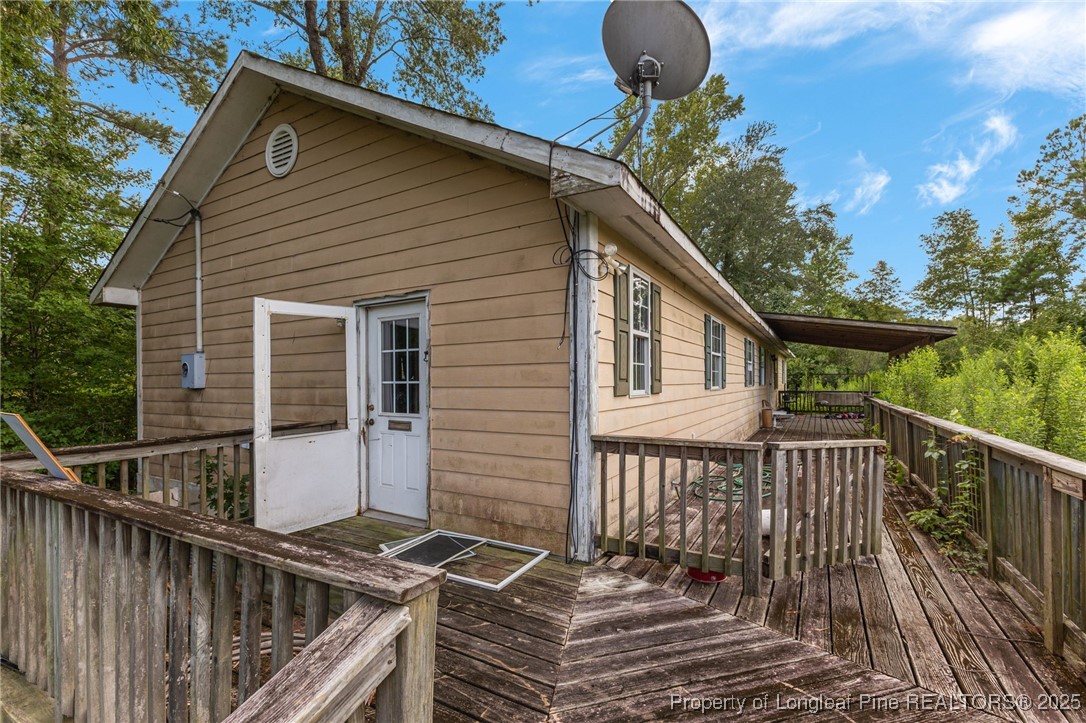 3402 Pine Log Road Lumberton, NC 28360 - Photo 6 of 24 a balcony view with a garden