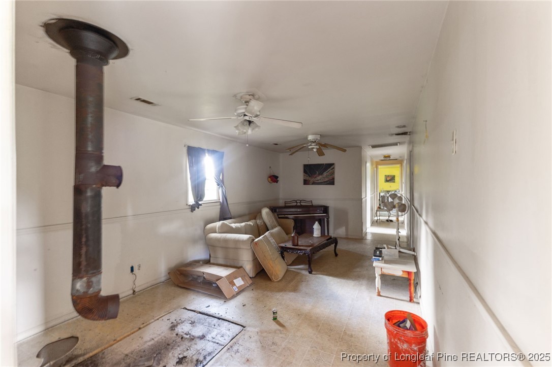 3402 Pine Log Road Lumberton, NC 28360 - Photo 7 of 24 a living room with furniture and a window
