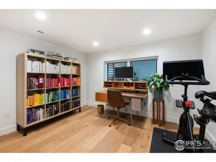 a bedroom with bed and window