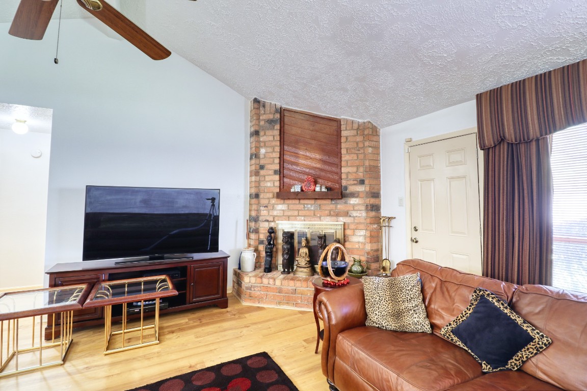 3446 Cheaney Drive Houston, TX 77066 - Photo 20 of 49 a living room with furniture flat screen tv and a window