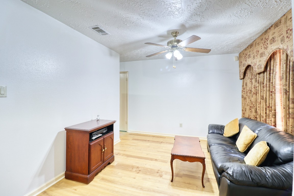 3446 Cheaney Drive Houston, TX 77066 - Photo 23 of 49 a living room with furniture and a ceiling fan