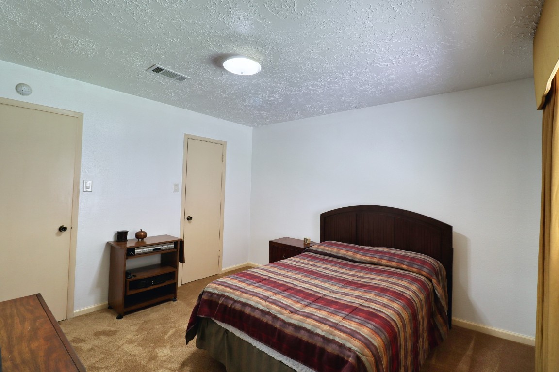 3446 Cheaney Drive Houston, TX 77066 - Photo 30 of 49 a bedroom with a bed and a television