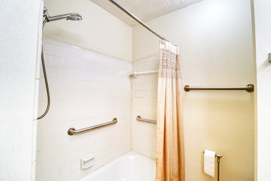 3446 Cheaney Drive Houston, TX 77066 - Photo 39 of 49 a bathroom with a shower and a glass door