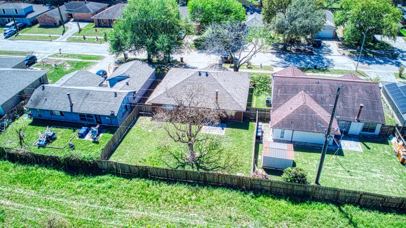 3446 Cheaney Drive Houston, TX 77066 - Photo 45 of 49 a aerial view of a house with a yard and a large pool