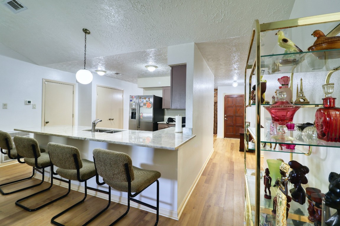 3446 Cheaney Drive Houston, TX 77066 - Photo 7 of 49 a large kitchen with a table and chairs