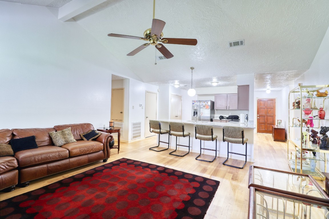 3446 Cheaney Drive Houston, TX 77066 - Photo 10 of 49 a living room with furniture and a view of kitchen