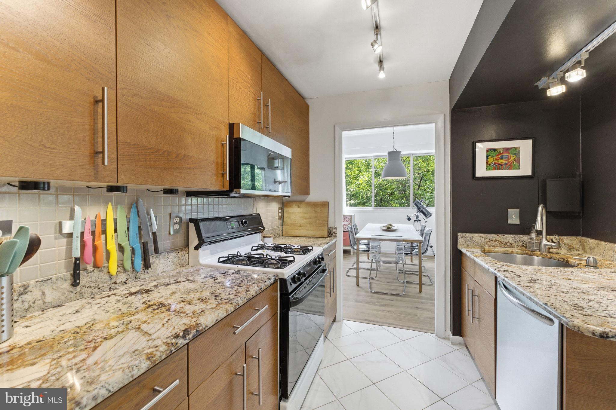 11260 Chestnut Grove Square, Unit 337 Reston, VA 20190 - Photo 21 of 82 Modern kitchen with sleek finishes.