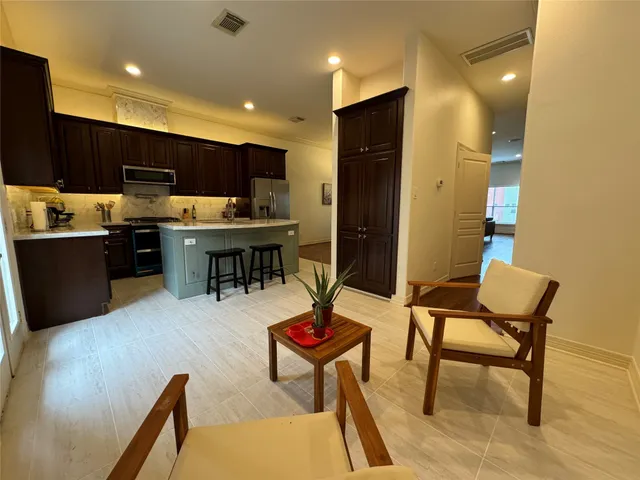 a view of a livingroom with furniture and wooden bench