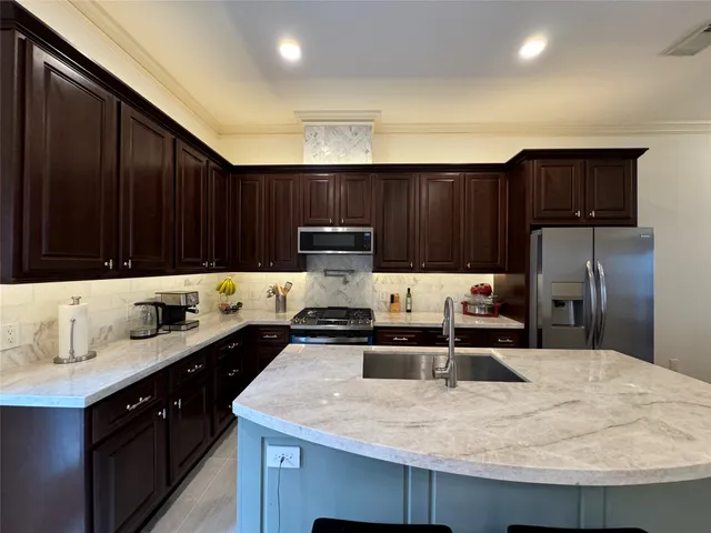 a living room with furniture a dining table and kitchen view