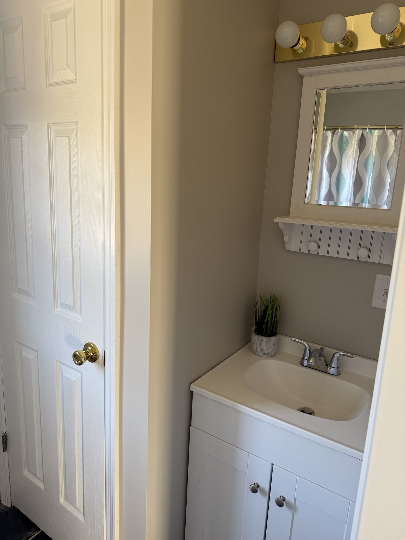 98 Ballenger Road Carthage, TN 37030 - Photo 17 of 23 a bathroom with a sink and mirror with toilet