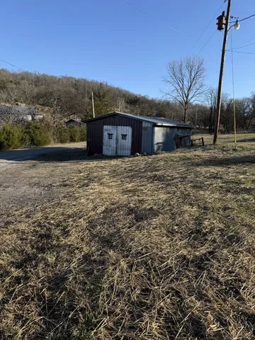 a view of a large house with a yard