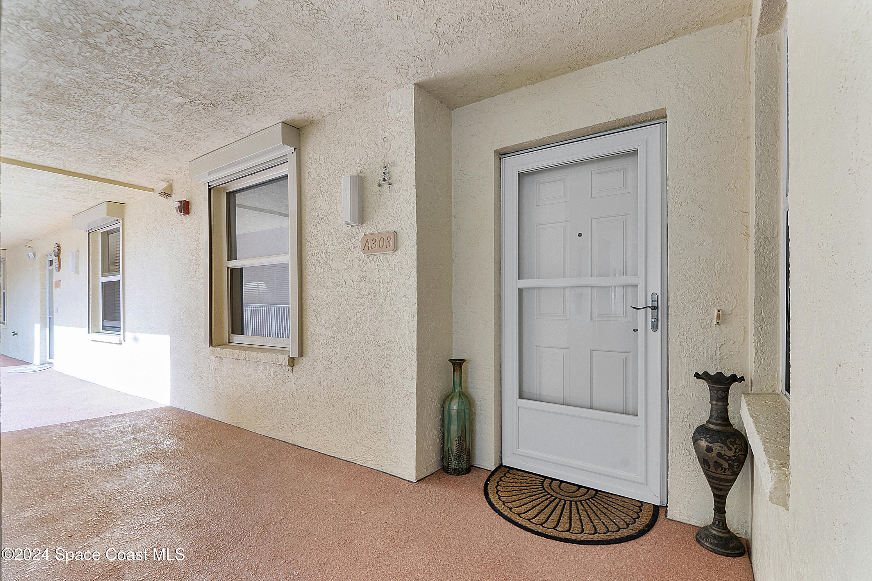 100 Riverside Drive, Unit 303 Cocoa, FL 32922 - Photo 3 of 72 storm door at entry
