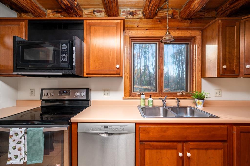 142 Cashdollar Road Mars, PA 16046 - Photo 13 of 44 a kitchen with a sink and a microwave