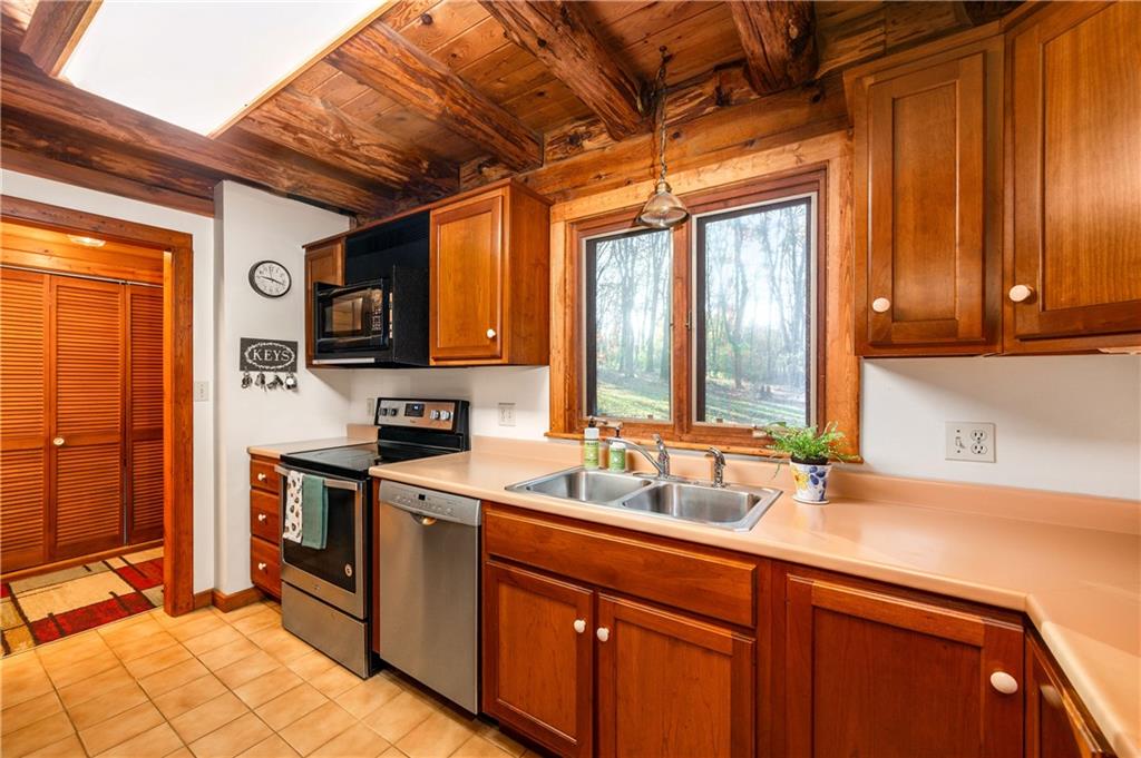 142 Cashdollar Road Mars, PA 16046 - Photo 14 of 44 a kitchen with stainless steel appliances granite countertop a sink stove and refrigerator