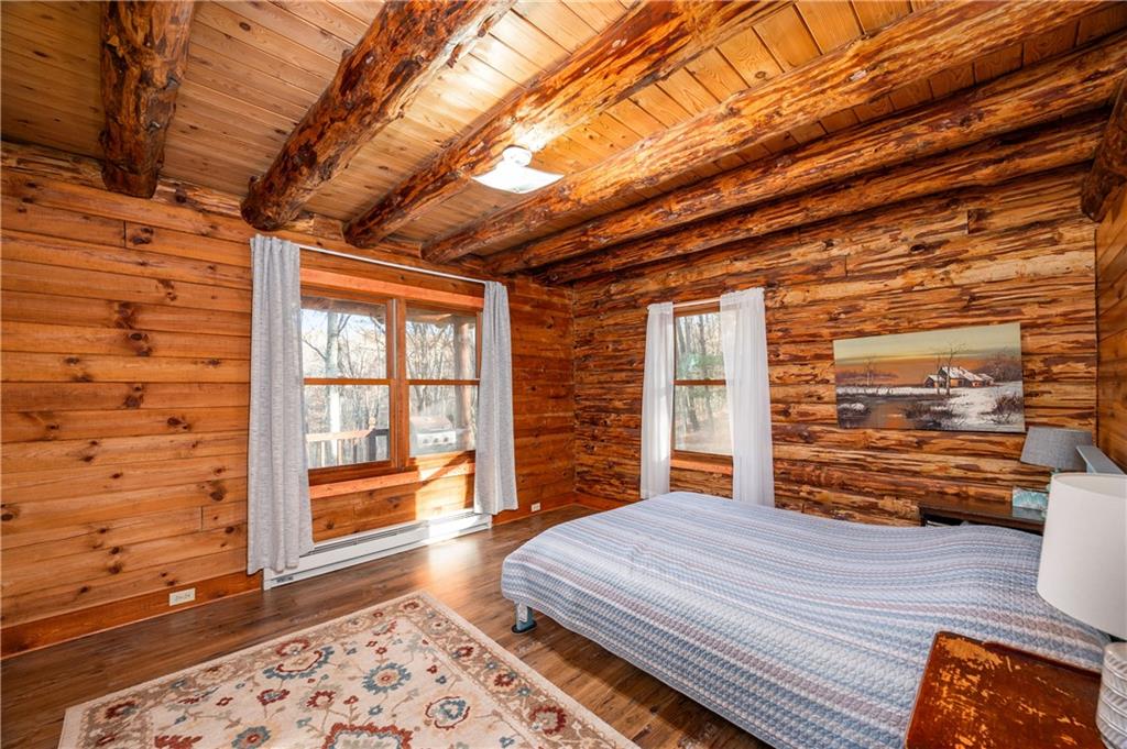 142 Cashdollar Road Mars, PA 16046 - Photo 16 of 44 a bedroom with a bed and wooden floor