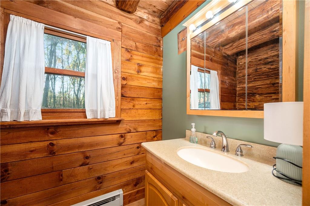 142 Cashdollar Road Mars, PA 16046 - Photo 19 of 44 a bathroom with a sink and a mirror