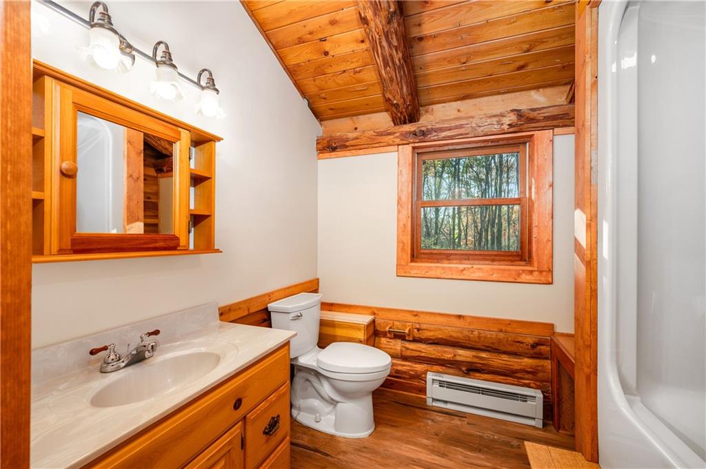 142 Cashdollar Road Mars, PA 16046 - Photo 27 of 44 a bathroom with a granite countertop sink toilet a mirror and next to a window