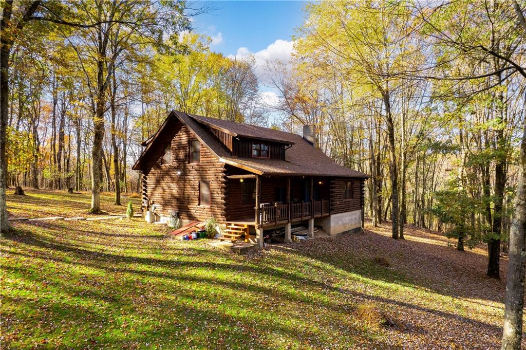 142 Cashdollar Road Mars, PA 16046 - Photo 3 of 44 a view of a house with large trees and a yard