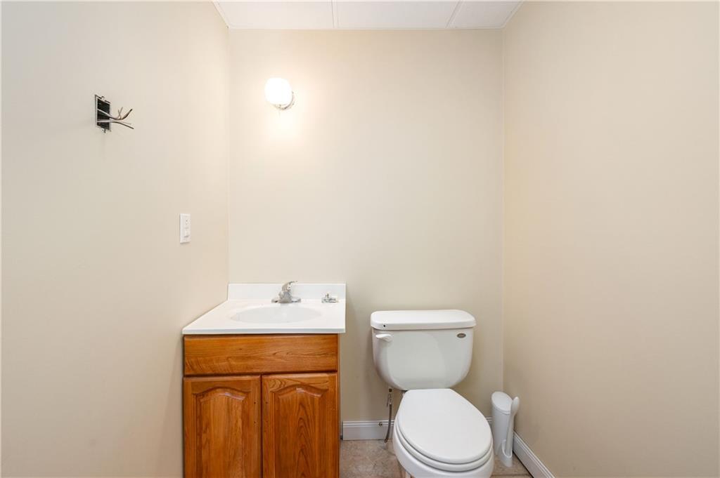 142 Cashdollar Road Mars, PA 16046 - Photo 31 of 44 a white toilet sitting next to a bathroom sink