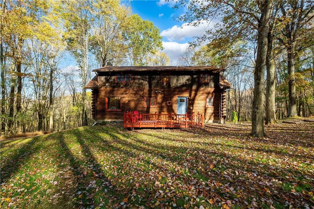 142 Cashdollar Road Mars, PA 16046 - Photo 35 of 44 a view of a wooden house with a big yard and large trees