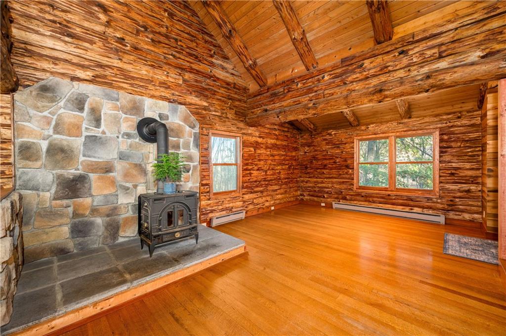 142 Cashdollar Road Mars, PA 16046 - Photo 9 of 44 a view of a livingroom with wooden floor and a ceiling fan