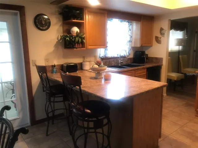 a kitchen with a table and chairs in it