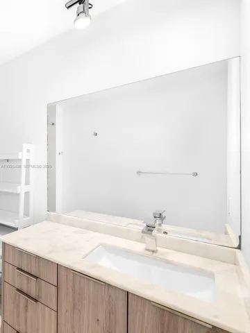 a bathroom with a bathtub and a sink