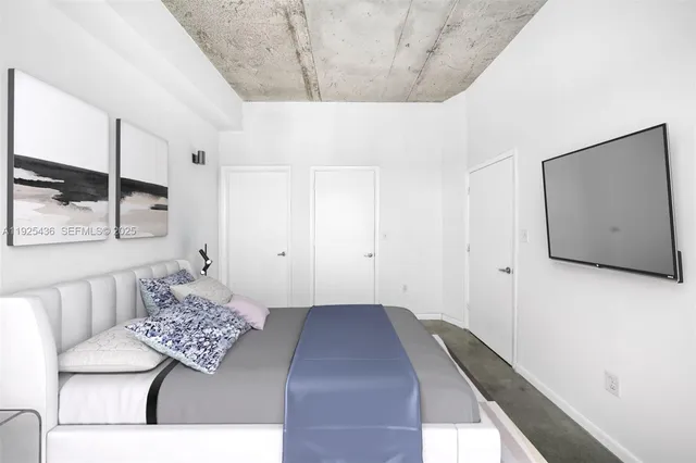 a bedroom with a bed and a couch