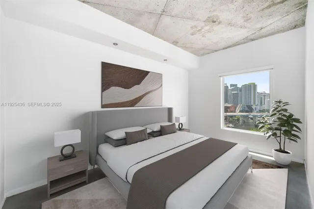 a bedroom with a bed and a potted plant