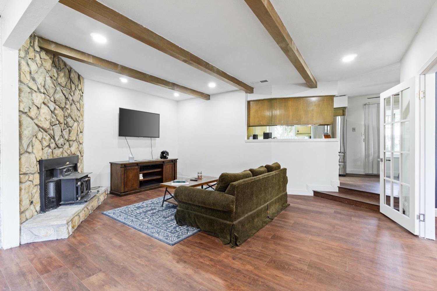 5654 North 7th Street Fresno, CA 93710 - Photo 14 of 38 a living room with furniture and a flat screen tv
